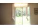 Living room with sliding glass doors opening to the backyard at 1609 Chelsea Manor Cir, Deland, FL 32724