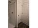 Bathroom with shower, door to linen closet, and vinyl flooring at 17 Juniper Dr, Ocala, FL 34480