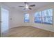 Spacious bedroom featuring wood-look floors and a ceiling fan at 17066 Se 93Rd Yondel Cir, The Villages, FL 32162