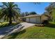 Two-car garage and driveway, tan house exterior at 17066 Se 93Rd Yondel Cir, The Villages, FL 32162