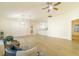 Open concept living room featuring hardwood floors and kitchen views at 17066 Se 93Rd Yondel Cir, The Villages, FL 32162