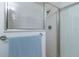 Shower with glass enclosure and tiled walls at 17066 Se 93Rd Yondel Cir, The Villages, FL 32162