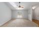 Spacious living room featuring neutral carpeting and a ceiling fan at 1815 Ne 39Th St, Ocala, FL 34479