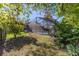 Landscaped backyard with a screened pool at 1825 Se 36Th Pl, Ocala, FL 34471