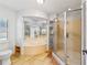 Bathroom with a large soaking tub, shower, and tile floor at 1825 Se 36Th Pl, Ocala, FL 34471