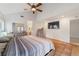 Main bedroom with tile floors, high ceilings, and a large bed at 1825 Se 36Th Pl, Ocala, FL 34471