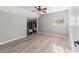 Well-lit bedroom featuring wood-look floors and a large closet at 1825 Se 36Th Pl, Ocala, FL 34471