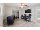 Bedroom with home office, wood-look floors, and a closet at 1825 Se 36Th Pl, Ocala, FL 34471