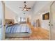 Main bedroom with tile floors, high ceilings, and a large bed at 1825 Se 36Th Pl, Ocala, FL 34471