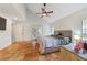 Main bedroom with tile floors, high ceilings, and a large bed at 1825 Se 36Th Pl, Ocala, FL 34471