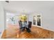 Sunlit dining room with hardwood floors and access to the backyard at 1825 Se 36Th Pl, Ocala, FL 34471