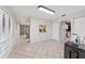 View of the entry hall with kitchen pass-through and access to other rooms at 1825 Se 36Th Pl, Ocala, FL 34471