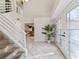 Spacious entryway with tiled floors, a staircase, and access to the kitchen at 1825 Se 36Th Pl, Ocala, FL 34471