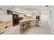 Open kitchen featuring granite countertops and an island with seating at 1825 Se 36Th Pl, Ocala, FL 34471
