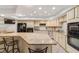 Spacious kitchen with granite island, breakfast bar, and stainless steel appliances at 1825 Se 36Th Pl, Ocala, FL 34471
