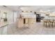 Kitchen with granite island, breakfast bar, and stainless steel appliances at 1825 Se 36Th Pl, Ocala, FL 34471
