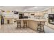 Large kitchen with granite island, breakfast bar, and stainless steel appliances at 1825 Se 36Th Pl, Ocala, FL 34471