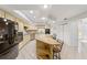 Spacious kitchen with granite countertops and an island with seating at 1825 Se 36Th Pl, Ocala, FL 34471