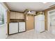 Bright laundry room with washer, dryer, and ample storage at 1825 Se 36Th Pl, Ocala, FL 34471