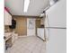 Laundry room with washer, dryer, cabinets, and extra refrigerator at 1825 Se 36Th Pl, Ocala, FL 34471