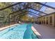 Screened pool and patio with lounge chairs at 1825 Se 36Th Pl, Ocala, FL 34471