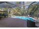 Relaxing screened pool area with patio furniture at 1825 Se 36Th Pl, Ocala, FL 34471