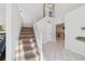 Staircase leading to upper level with kitchen view at 1825 Se 36Th Pl, Ocala, FL 34471