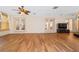 Spacious sunroom with wood-look floors and access to other rooms at 1825 Se 36Th Pl, Ocala, FL 34471