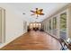 Sunroom boasting wood-look floors and access to the pool at 1825 Se 36Th Pl, Ocala, FL 34471