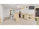 Wet bar with granite countertop, mini-fridge, and glass shelving at 1825 Se 36Th Pl, Ocala, FL 34471
