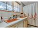 Bathroom with dual sinks, vintage tile, and shower at 208 Ne 70Th St, Ocala, FL 34479