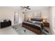 Inviting main bedroom with a comfortable bed, stylish decor, and a ceiling fan at 23 Pine Course Loop, Ocala, FL 34472