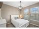 Well-lit bedroom featuring a white bed frame, new window blinds and plush carpeting at 3480 Nw 55Th Ct, Ocala, FL 34482