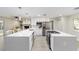 Modern kitchen with white cabinets, quartz countertops and island at 4328 Ne 12Th St, Ocala, FL 34470