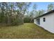 White house exterior with covered patio and large backyard at 6366 Sw 153Rd Lane Rd, Ocala, FL 34473