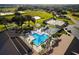 Aerial view of community pool, tennis courts, and other amenities at 8478 Sw 60Th Ct, Ocala, FL 34476