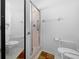 Accessible bathroom featuring roll-in shower and grab bars at 8478 Sw 60Th Ct, Ocala, FL 34476