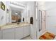 Vanity with marble countertop and adjacent shower at 8478 Sw 60Th Ct, Ocala, FL 34476