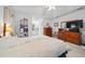 Main bedroom with dresser and view into bathroom at 8478 Sw 60Th Ct, Ocala, FL 34476