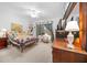 Main bedroom with comfortable bed and built-in dresser at 8478 Sw 60Th Ct, Ocala, FL 34476