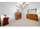 Bright bedroom with wood furniture and ceiling fan at 8478 Sw 60Th Ct, Ocala, FL 34476