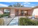 Welcoming front porch with a decorative walkway and fountain at 8478 Sw 60Th Ct, Ocala, FL 34476