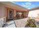 Inviting front porch with decorative door, small fountain, and seating area at 8478 Sw 60Th Ct, Ocala, FL 34476