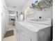 Bright laundry room with washer, dryer, and storage at 8478 Sw 60Th Ct, Ocala, FL 34476