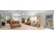 Living room with vaulted ceilings, leather furniture, and an open floor plan at 8478 Sw 60Th Ct, Ocala, FL 34476