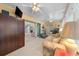 Bright sunroom with sliding doors, exercise equipment, and comfortable seating at 8478 Sw 60Th Ct, Ocala, FL 34476