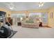 Spacious sunroom with multiple windows, a couch, and an elliptical at 8478 Sw 60Th Ct, Ocala, FL 34476