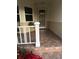 Front porch entry with tiled flooring and white railing at 9085 Sw 96Th Ln # B, Ocala, FL 34481