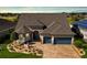 Luxury home with 3-car garage, solar panels, and landscaped yard at 9551 Sw 70Th Loop, Ocala, FL 34481