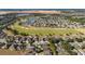 Aerial view of neighborhood with golf course and lake at 9551 Sw 70Th Loop, Ocala, FL 34481